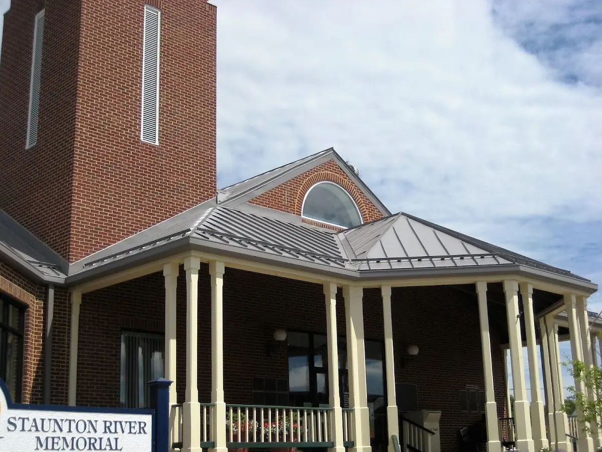 Skilled roofing craftsmen working on a residential roof in Morgantown